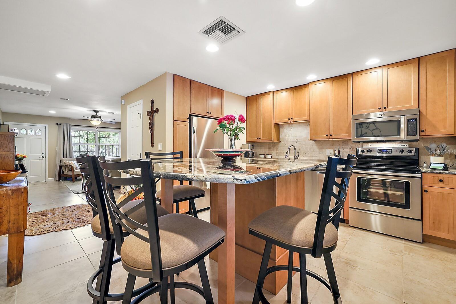 Eat-in Kitchen with a 4-top center island bar