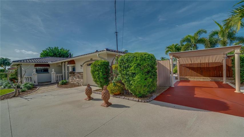arking - Extra carport parking on right side of home. Fully paved and landscaped. Entrances to the backyard patio and gardens are on both sides of the carport.