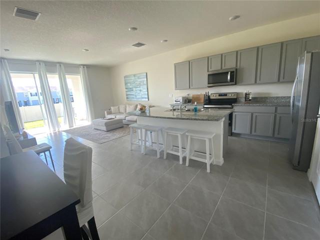 Open concept kitchen, dining, living room