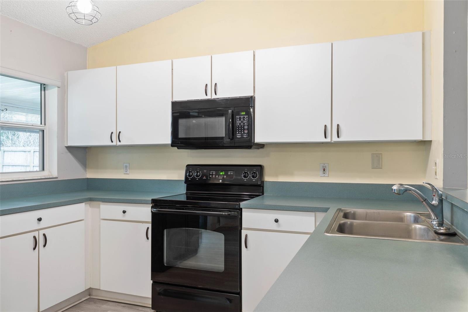 Kitchen Window and plenty of Cabinets