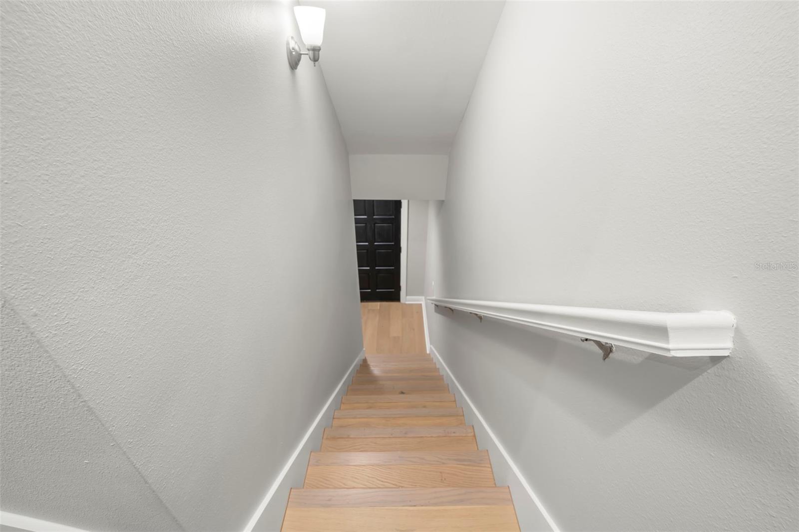 Stairs from Second Floor to front door and In Law.