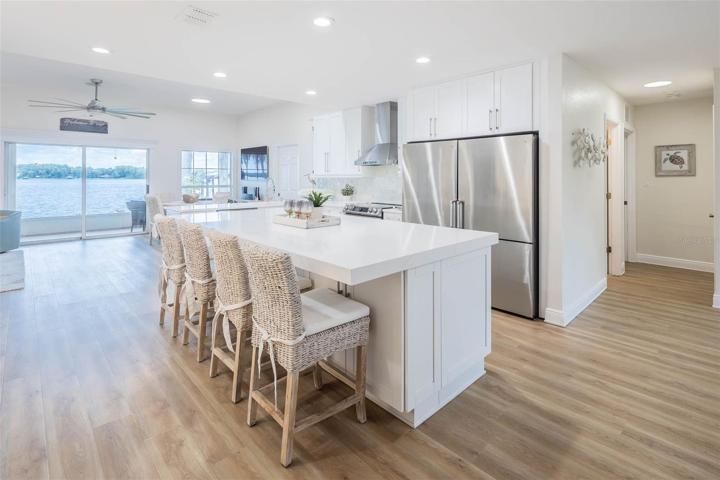 Large Open Kitchen with Direct Lake Views. Beautiful Quartz surfaces.