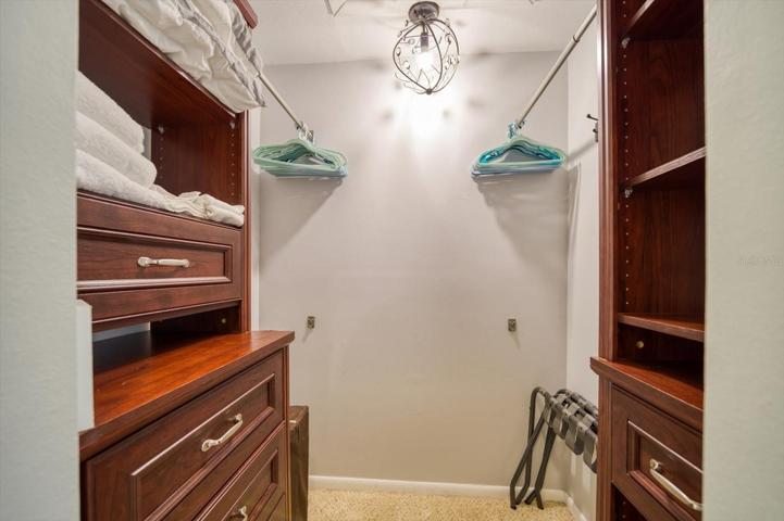 Primary bedroom walk in closet