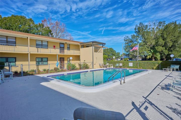 Unit 114 is located on the far side of the pool in this view