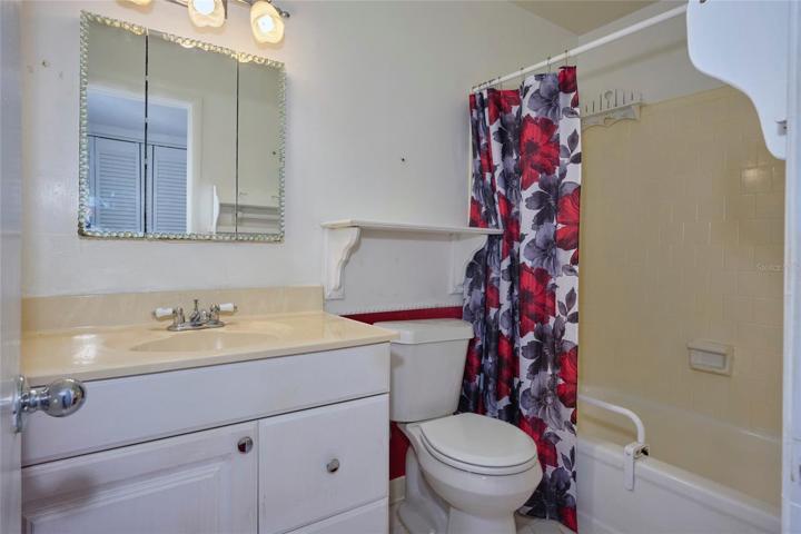 Guest bathroom offers a tub/shower combo