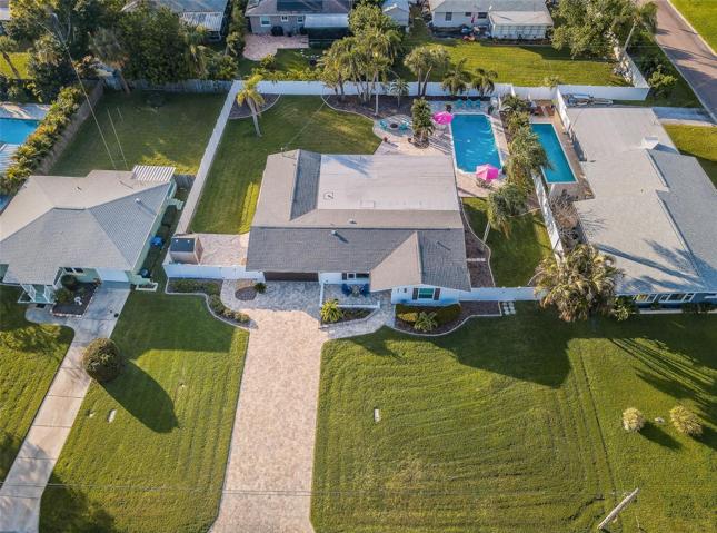 So rare in Pinellas County, look at the space of this home's double lot!