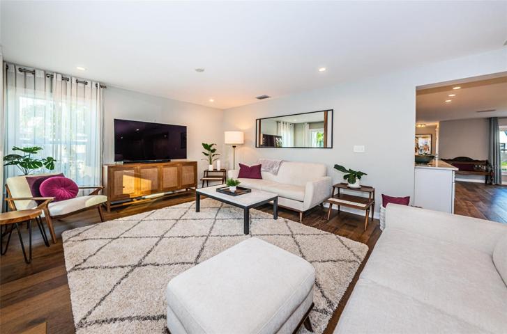 Living room is directly open to the kitchen and dining room.