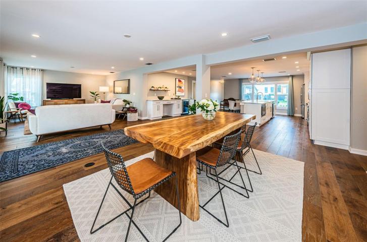 Large dining room is adjacent to the kitchen making a dinner party a breeze.