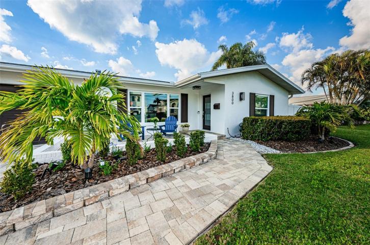 Custom pavers lead you to this updated home.