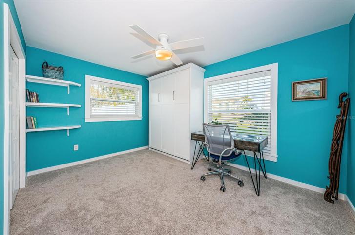 Bedroom 3 is at the front of the home and features a queen size Murphy bed.