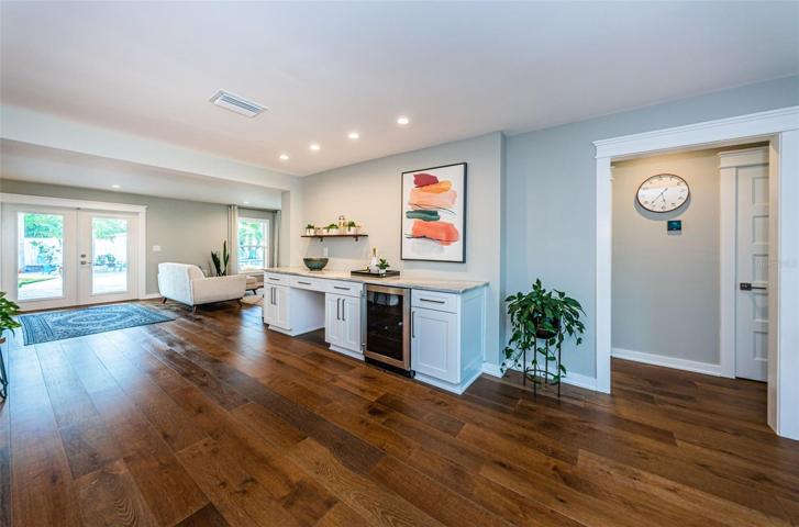 The beverage station further anchors the kitchen space.