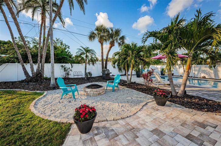 Pavers lead to the outdoor firepit area to enjoy those beautiful Florida evenings.