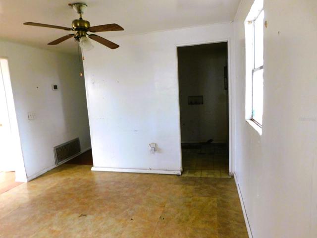 Dining area into laundry room.