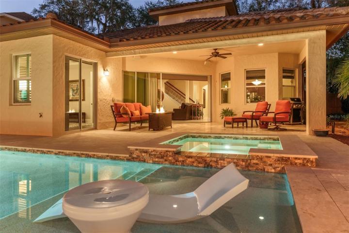Large covered patio overlooking pool