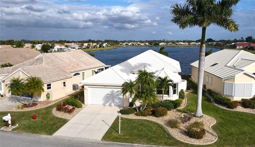 Aerial view of home including lake