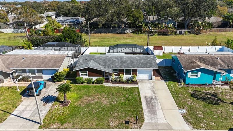 DRONE VIEW OF HOME SHOWING DOUBLE PARKING PAD