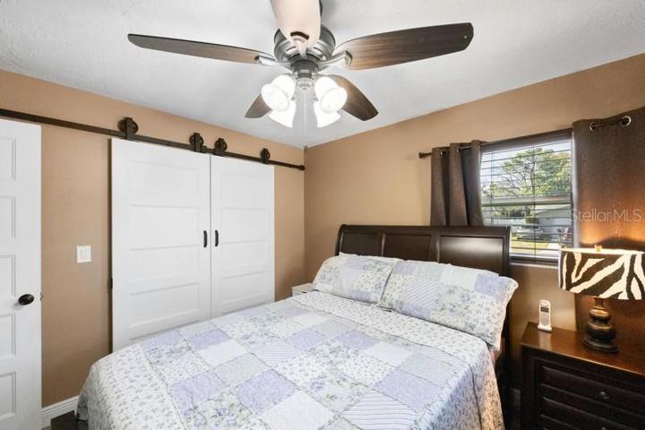 BEDROOM 2 SHOWING BARN DOOR CLOSET DOORS