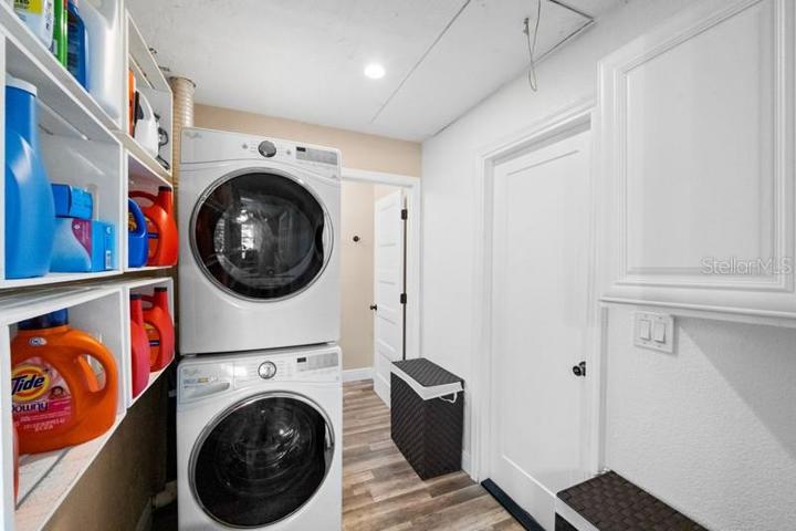 LAUNDRY ROOM WITH STORAGE SHELVES