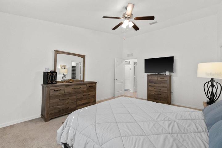 Owners suite featuring a walk-in closet, and ensuite bathroom.