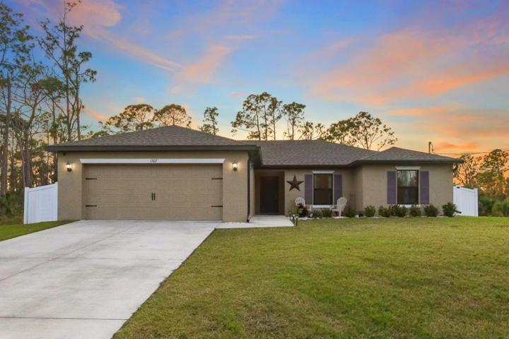 Front Elevation showing the large front patio, and two car garage.