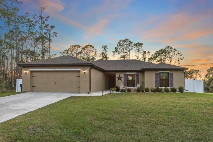 Front Elevation showing the large front patio, and two car garage.