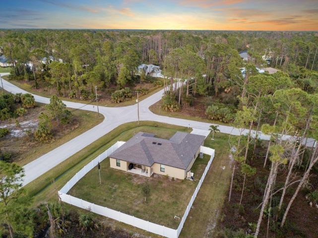Aerial view showing the large lot and the back yard.