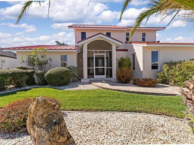 127 Hibiscus Dr - welcome to this generously sized 4 bedroom waterfront pool home with 2nd level 55-ft deck