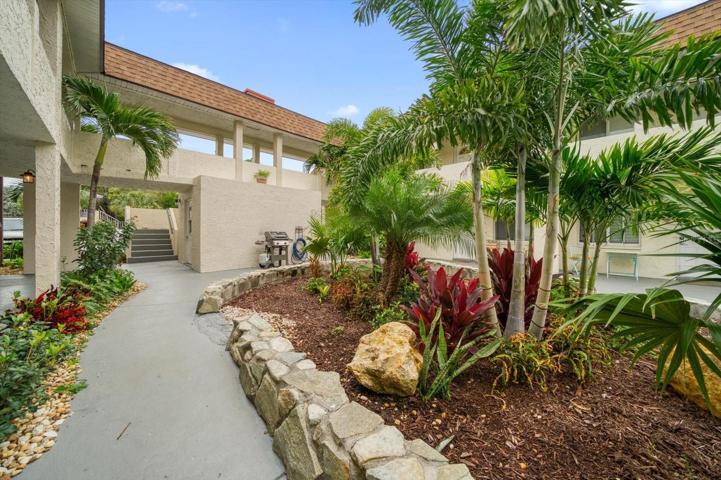 Tropical landscaping and well maintained grounds makes relaxing EASY!