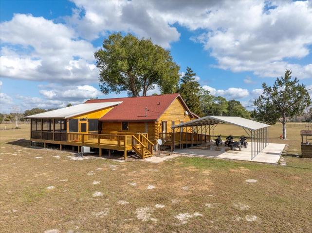 Back View of Cabin with Covered Parking Pad