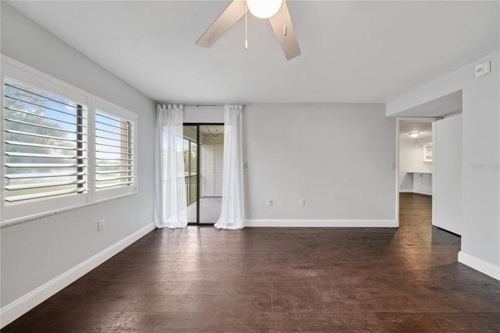Sliding glass door out to the balcony from the primary bedroom