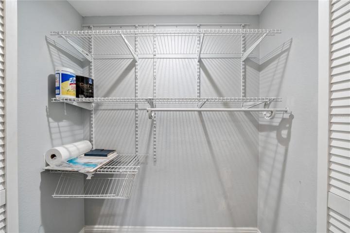 Storage closet in the hall next to the second bedroom and bathroom