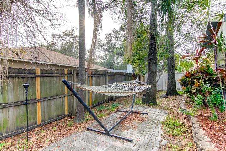 Great paved area for a hammock, or small playset