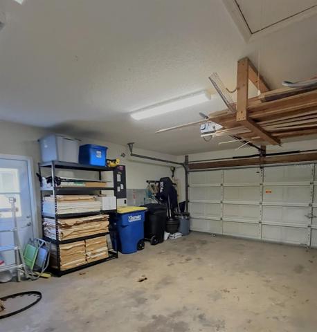 Half of garage with new side door.