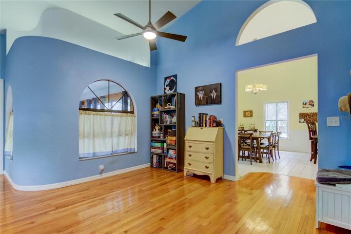 Window view to enclosed bonus space and dining entry