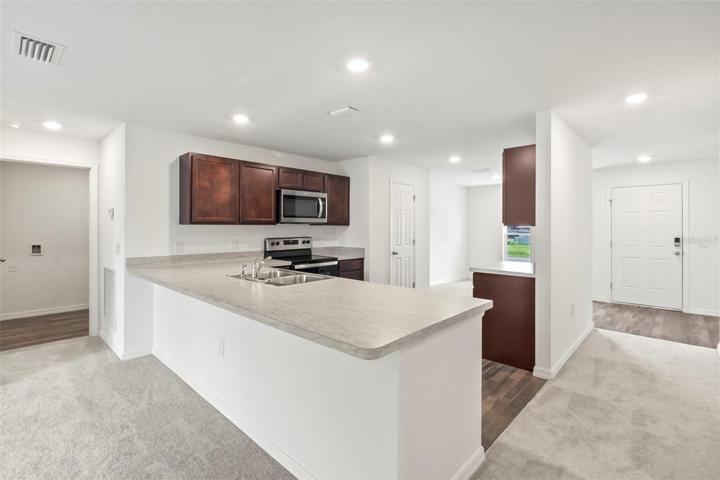 kitchen - laundry room shown on left