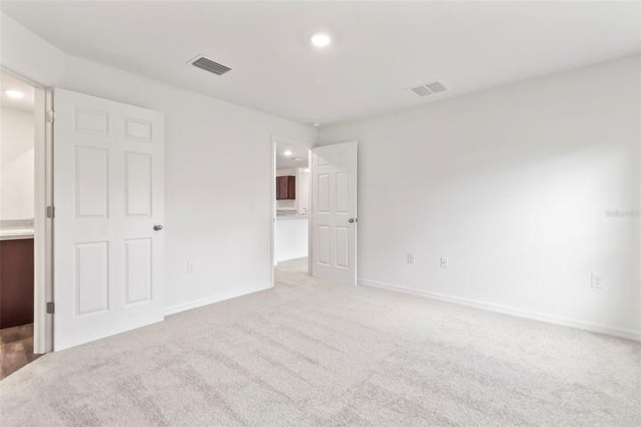 Master bedroom (ensuite bath - left) looking to kitchen/great room