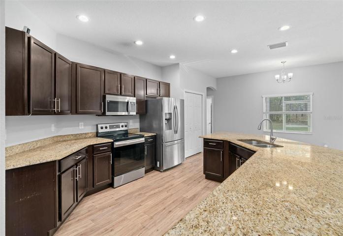 Open and spacious kitchen with granite countertops