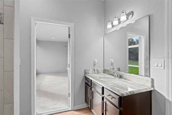 Spacious bathroom with access to screened in lanai