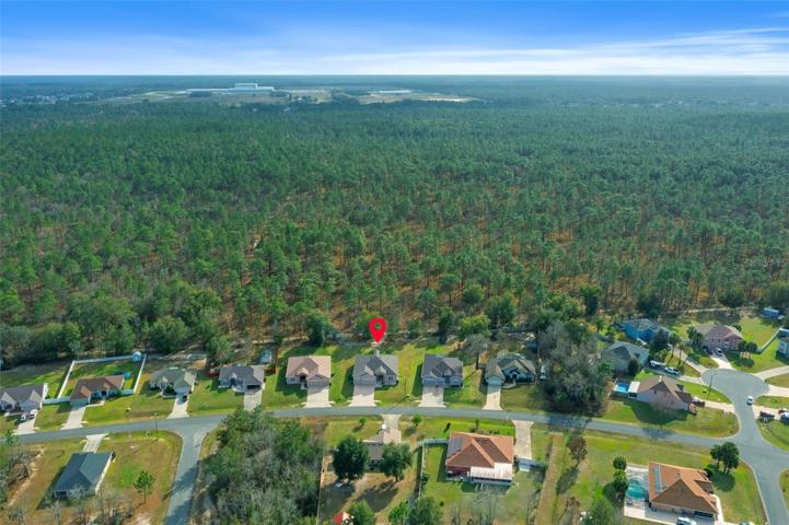 Property backs up to the 49th Ave Trail/ forrest