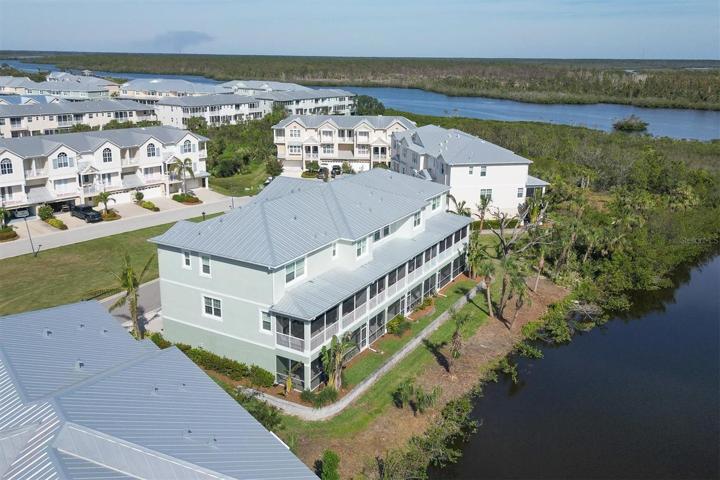Views from this residence overlook the pond and Coral Creek in the distance