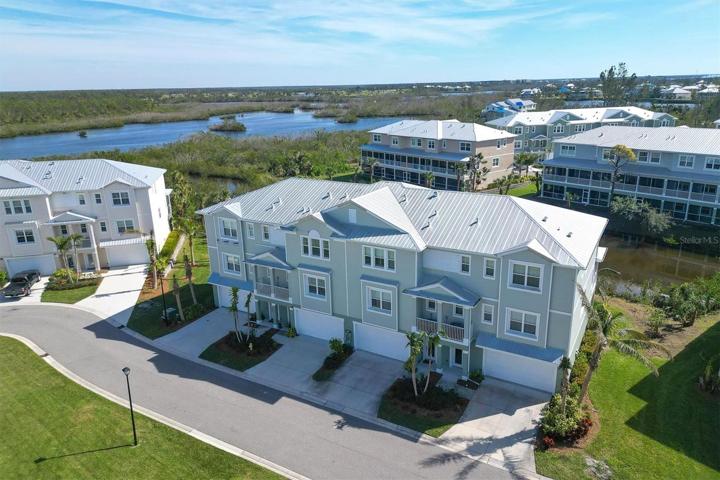 This residence overlooks a pond in the rear and the upper level captures some views overlooking Coral Creek