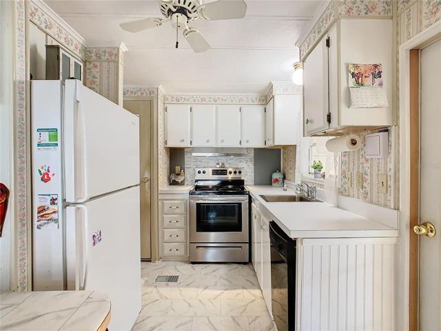 The kitchen has an updated stove and an economy size dishwasher