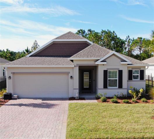 Front of house w/ paver driveway & walkway