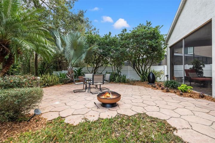 Outdoor entertaining area with pavers and view to the garden