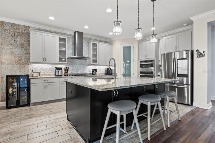 Stunning Kitchen with upgraded lighting fixtures, quartz back splash, 42
