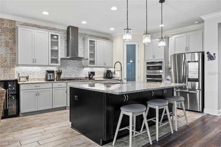 Stunning Kitchen with upgraded lighting fixtures, quartz back splash, 42