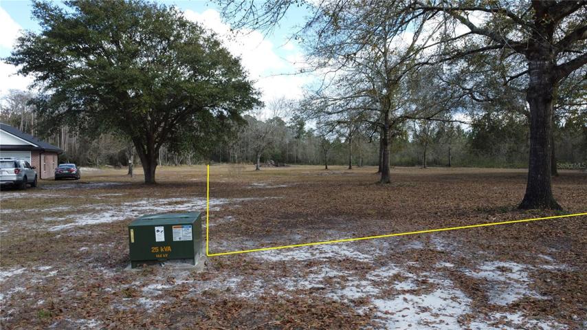 Standing on Mohawk St facing East.  North property line heading towards the rear of the lot.Property lines indicated are approximate and used for visual assistance only.
