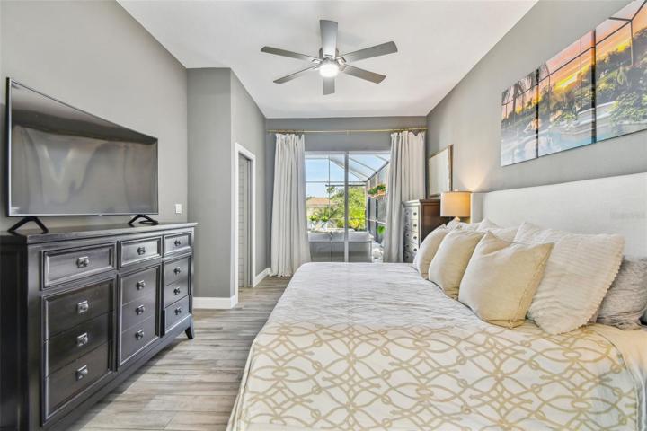 Master bedroom with view of pool & pond