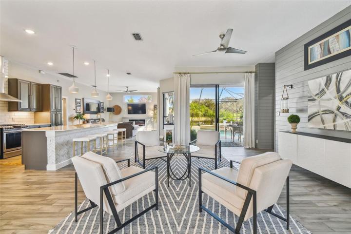 Living room with view of pool & pond