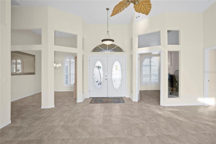 Living room looking at front door. Dining to the left and Study den ot the right.